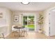 Bright dining area featuring a sliding door to the backyard and modern furnishings at 3839 E Friess Dr, Phoenix, AZ 85032