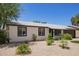 Charming single-story home featuring desert landscaping and a freshly painted exterior at 3839 E Friess Dr, Phoenix, AZ 85032