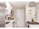 Contemporary kitchen featuring stainless steel appliances, white cabinetry, and a gas range at 3839 E Friess Dr, Phoenix, AZ 85032