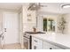 Bright kitchen boasts stainless steel appliances, herringbone backsplash, and quartz countertops on a large island at 3839 E Friess Dr, Phoenix, AZ 85032