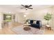 Bright living room featuring hardwood floors, modern furnishings, and ample natural light at 3839 E Friess Dr, Phoenix, AZ 85032
