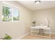 Bright office space with a modern desk, natural light, and a view of the outdoors at 3839 E Friess Dr, Phoenix, AZ 85032