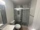 Beautifully remodeled bathroom features a modern vanity, toilet, and updated shower at 3844 N 88Th Ln, Phoenix, AZ 85037