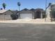 Charming single-Gathering home featuring a two-car garage and arched entryway at 3844 N 88Th Ln, Phoenix, AZ 85037