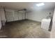 Spacious garage with overhead door, laundry appliances and water heater at 3844 N 88Th Ln, Phoenix, AZ 85037