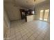 Open-concept kitchen with an island and stainless steel appliances at 3844 N 88Th Ln, Phoenix, AZ 85037
