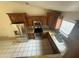 Well-lit kitchen featuring stainless steel appliances and ample cabinet space at 3844 N 88Th Ln, Phoenix, AZ 85037