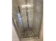 Modern bathroom featuring a shower with decorative tile at 3844 N 88Th Ln, Phoenix, AZ 85037