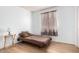 Minimalist bedroom featuring laminate floors and natural light at 403 N Monte Vista St, Chandler, AZ 85225