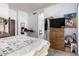 This bedroom features wood floors, an ironing board, and neutral decor at 403 N Monte Vista St, Chandler, AZ 85225