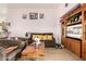 This living room features tile floors, a sofa, and a view into the kitchen at 403 N Monte Vista St, Chandler, AZ 85225