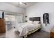 Calm main bedroom with a large window, sliding door, and tile flooring at 403 N Monte Vista St, Chandler, AZ 85225