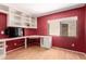 Office with built-in shelving, hardwood floors, and white trim at 4135 E Altadena Ave, Phoenix, AZ 85028