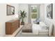Serene bedroom featuring a dresser, cozy chair, stylish decor, and a bright window for ample natural light at 42515 W Peters Dr, Maricopa, AZ 85138