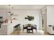 Bright dining area adjacent to the kitchen with modern pendant lighting and neutral decor for a comfortable feel at 42515 W Peters Dr, Maricopa, AZ 85138