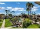Aerial shot of community with pool, palm trees, manicured lawns, and seating at 4600 N 68Th St # 351, Scottsdale, AZ 85251