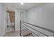Hallway leading to a bathroom, featuring modern railings and contemporary design at 4600 N 68Th St # 351, Scottsdale, AZ 85251