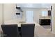 Bright kitchen featuring white quartz countertops and open shelving at 4600 N 68Th St # 351, Scottsdale, AZ 85251