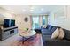 Comfortable living room featuring a stylish sectional sofa and sliding glass doors at 4600 N 68Th St # 351, Scottsdale, AZ 85251