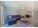 Open-concept living room with large sectional and stylish decor with kitchen bar at 4600 N 68Th St # 351, Scottsdale, AZ 85251