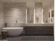 Modern bathroom featuring soaking tub, double vanity, and stylish finishes at 5050 N Camelback Ridge Dr # 2306, Scottsdale, AZ 85251
