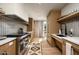 Modern kitchen design with high-end stainless steel appliances, sleek cabinetry and natural light at 5050 N Camelback Ridge Dr # 2306, Scottsdale, AZ 85251