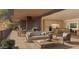 Spacious outdoor living area with comfortable seating, dining, and full kitchen at 5050 N Camelback Ridge Dr # 2306, Scottsdale, AZ 85251