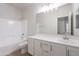 Bright bathroom with a tub and shower combination plus single sink vanity at 5434 W T Ryan Ln, Laveen, AZ 85339