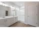 Bright bathroom showcasing double sinks, a large mirror, and a glass-enclosed shower at 5434 W T Ryan Ln, Laveen, AZ 85339