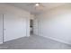 An unfurnished bedroom with closet and ceiling fan offers versatile living space at 5434 W T Ryan Ln, Laveen, AZ 85339