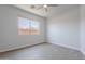 An unfurnished bedroom with neutral tones and a window offers versatile living space at 5434 W T Ryan Ln, Laveen, AZ 85339