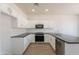 Clean kitchen with stainless steel appliances and white cabinets, with granite counters at 5434 W T Ryan Ln, Laveen, AZ 85339
