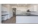 Bright kitchen with stainless steel appliances, granite counters, and a breakfast bar at 5434 W T Ryan Ln, Laveen, AZ 85339