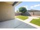 Inviting backyard with a well-manicured lawn and shaded patio for relaxation and entertainment at 626 W Tallula Trl, San Tan Valley, AZ 85140