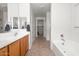 Bright bathroom with double sinks, soaking tub, and separate shower at 626 W Tallula Trl, San Tan Valley, AZ 85140