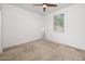 Minimalist bedroom with lots of natural light and ceiling fan at 626 W Tallula Trl, San Tan Valley, AZ 85140