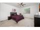 Serene bedroom with plush carpeting, ceiling fan, and neutral decor, creating a relaxing retreat at 626 W Tallula Trl, San Tan Valley, AZ 85140