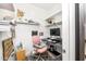 Functional home office with organized shelving, comfortable chair, and natural light, perfect for productivity at 626 W Tallula Trl, San Tan Valley, AZ 85140