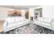 Spacious and connected living room with an open floorplan, tile flooring, view into kitchen and casual seating at 626 W Tallula Trl, San Tan Valley, AZ 85140