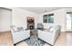 Comfortable living room with tile flooring, a decorative fireplace, and stylish seating and view of the window at 626 W Tallula Trl, San Tan Valley, AZ 85140
