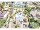 An aerial view of the home featuring a swimming pool, and well-manicured desert landscaping at 6302 E Turquoise Ave, Paradise Valley, AZ 85253