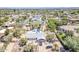 An aerial view of the home featuring desert landscaping, a pool, and nearby mountains at 6302 E Turquoise Ave, Paradise Valley, AZ 85253