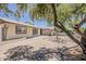 Spacious backyard patio with pavers, partially shaded with mature landscaping, perfect for outdoor entertaining at 6302 E Turquoise Ave, Paradise Valley, AZ 85253