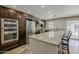 Modern kitchen with stainless steel appliances, dark wood cabinets, and granite counters, perfect for cooking at 6302 E Turquoise Ave, Paradise Valley, AZ 85253