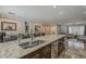 Expansive kitchen island featuring granite countertops and stainless steel appliances, perfect for entertaining at 6302 E Turquoise Ave, Paradise Valley, AZ 85253