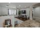 Comfortable living room featuring stylish decor, a large window, and seamless access to other living spaces at 6302 E Turquoise Ave, Paradise Valley, AZ 85253
