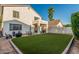 Expansive backyard boasts an artificial lawn, inviting seating areas, and a well-manicured landscape at 6846 S 26Th Pl, Phoenix, AZ 85042