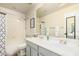 Bright bathroom with double sink vanity, modern fixtures, and a tub/shower combination at 6846 S 26Th Pl, Phoenix, AZ 85042