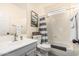This bathroom features a shower-tub combo and modern finishes at 6846 S 26Th Pl, Phoenix, AZ 85042