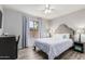 This bedroom features wood-look floors and a dedicated desk area at 6846 S 26Th Pl, Phoenix, AZ 85042